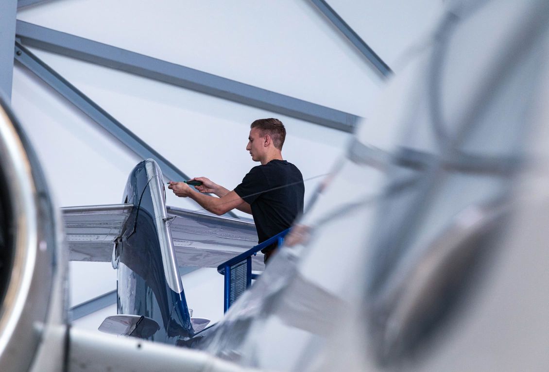 Aircraft mechanic working on ambulance jet